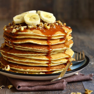 Pancakes with banana,walnut and caramel for a breakfast.
