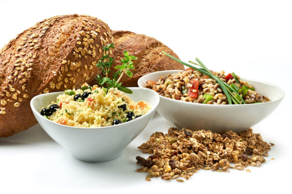 Bread and various whole grains in bowls.