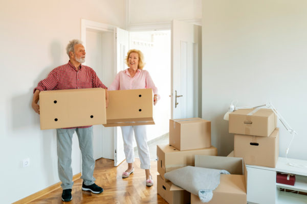 Older couple with moving boxes