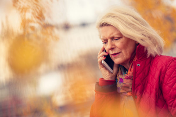Distressed woman on cell phone