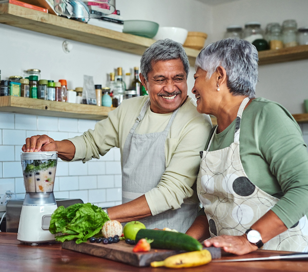 Shot of a senior couple preparing a healthy smoothie in the kitchen at home